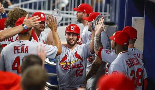St. Louis Cardinals&#x27; Paul DeJong (12) is congratulated by teammates after his two-run home run during the fourth inning of a baseball game against the Atlanta Braves, Tuesday, Sept. 18, 2018, in Atlanta. (AP Photo/Todd Kirkland)