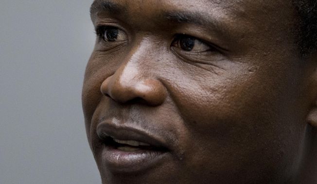 FILE - In this Tuesday, Dec. 6, 2016 file photo, Dominic Ongwen, a senior commander in the Lord&#x27;s Resistance Army, whose fugitive leader Kony is one of the world&#x27;s most-wanted war crimes suspects, sits in the court room of the International Court in The Hague, Netherlands. In his opening statement on Tuesday Sept. 18, 2018, a lawyer defending Ongwen accused of crimes including murder, sexual slavery and using child soldiers is casting him as a victim of the rebel group&#x27;s brutal leader, Joseph Kony. (AP Photo/Peter Dejong, Pool, File)