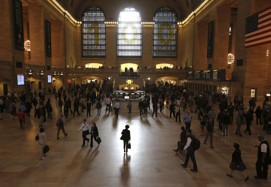 FILE- In this Sept. 26, 2013, file photo people make their way through Grand Central Terminal in New York. Travel can be busy, noisy and crowded — a potentially daunting environment for anyone. But if you’re an introvert, it can drain your internal battery. Studies and experts suggest this personality type processes social stimuli differently from extroverts, who don’t mind frequent interaction. (AP Photo/Mary Altaffer, File)