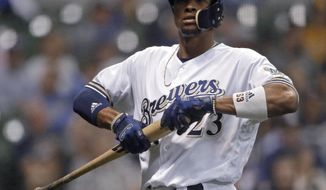 Milwaukee Brewers&#39; Keon Broxton walks back to the dugout after striking out during the sixth inning against the Cincinnati Reds in a baseball game Tuesday, Sept. 18, 2018, in Milwaukee. (AP Photo/Aaron Gash)