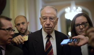 Sen. Chuck Grassley, R-Iowa, walks past members of the media as he heads to the Senate Chamber floor on Capitol Hill in Washington, Tuesday, Sept. 18, 2018. (AP Photo/Pablo Martinez Monsivais) ** FILE **