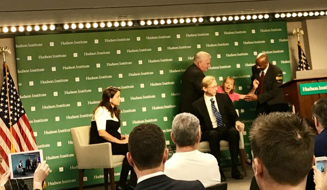 A lone anti-war activist from &quot;Code Pink&quot; disrupted an event at the Hudson Institute think tank in Washington, where U.S. Special Envoy to Iran Brian Hook was outlining the Trump administration&#x27;s plan to increase sanctions on Tehran, on Wednesday, Sept. 19, 2018. The protester yelled, &quot;No more war, peace with Iran,&quot; before being removed by security. (The Washington Times/Guy Taylor)