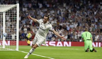 Real midfielder Gareth Bale celebrates after scoring his side&#39;s second goal during a Group G Champions League soccer match between Real Madrid and Roma at the Santiago Bernabeu stadium in Madrid, Spain, Wednesday Sept. 19, 2018. (AP Photo/Manu Fernandez)