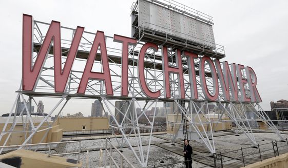 In this Wednesday, Dec. 9, 2015, file photo, the iconic Watchtower sign is seen on the roof of 25-30 Columbia Heights, then world headquarters of the Jehovah&#39;s Witnesses, in the Brooklyn borough of New York.  (AP Photo/Seth Wenig) **FILE**