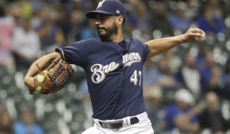 Milwaukee Brewers starting pitcher Gio Gonzalez throws during the first inning of a baseball game against the Cincinnati Reds Wednesday, Sept. 19, 2018, in Milwaukee. (AP Photo/Morry Gash)