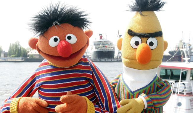 FILE - In this May 9, 2006, file photo, Ernie and Bert of “Sesame Street” pose in front of the Queen Mary II in the harbor of Hamburg, Germany. The producers of “Sesame Street” tweeted Tuesday, Sept. 18, 2018, that Bert and Ernie are not gay in response to a Queerty interview published Sunday, Sept. 16, 2018, with a former writer for the show who said he considered the puppets lovers. (AP Photo/Fabian Bimmer, File)