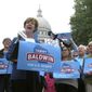 U.S. Sen. Tammy Baldwin, D-Wis. speaks to supporters and talks about her support for the national health care law before encouraging early voting on Thursday, Sept. 20, 2018, in Madison, Wis. Baldwin faces Republican Leah Vukmir in the November election. (AP Photo/Scott Bauer)