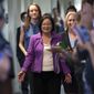 Sen. Mazie Hirono, D-Hawaii, flanked by Sarah Burgess, left, an alumnae of the Holton Arms School, and Sen. Kirsten Gillibrand, D-N.Y., right, is applauded by demonstrators as they arrive to speak to reporters in support of professor Christine Blasey Ford, who is accusing Supreme Court nominee Brett Kavanaugh of a decades-old sexual attack, during a news conference on Capitol Hill in Washington, Thursday, Sept. 20, 2018. Christine Blasey Ford was a student at the Holton Arms School, a Maryland all-girls school, in the early 1980s. (AP Photo/J. Scott Applewhite)