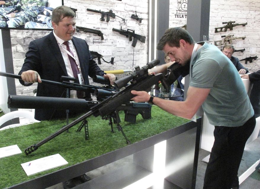 Russian sniper rifles are displayed at the the biennial Africa Aerospace and Defence Exhibition at the Waterkloof Airforce Base in Pretoria, South Africa Wednesday Sept. 19, 2018. (AP Photo/Christopher Torchia)