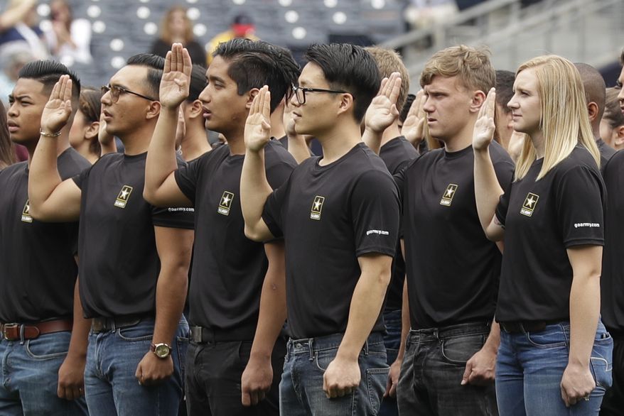 In this June 4, 2017, photo. new Army recruits take part in a swearing in ceremony before a baseball game between the San Diego Padres and the Colorado Rockies in San Diego. The Army has missed its recruiting goal for the first time in more than a decade. Army leaders tell The Associated Press they signed up about 70,000 new troops for the fiscal year that ends Sept. 30, 2018. (AP Photo/Gregory Bull) **FILE**