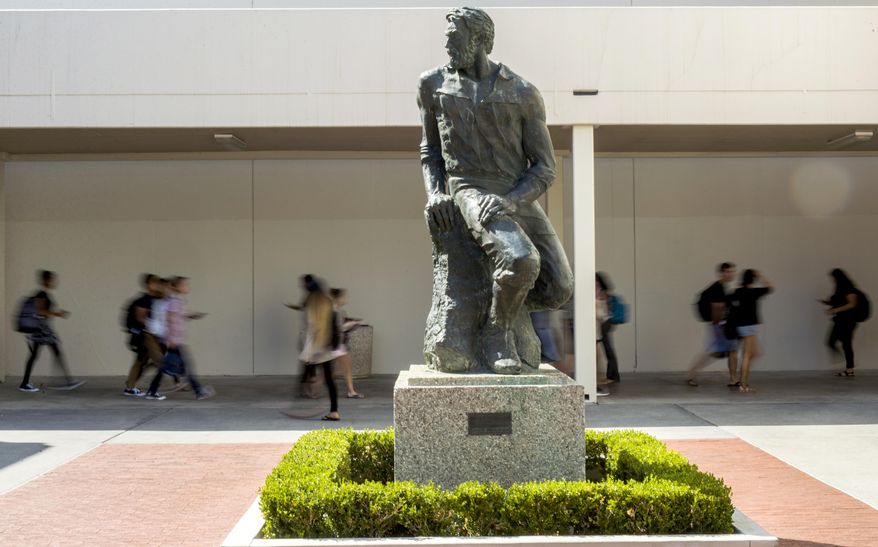 This Sept. 20, 2017 photo shows "Prospector Pete" statue at California State University, Long Beach, Calif. The school will be ousting its "Prospector Pete" statue because of the impact the 1849 gold rush had on indigenous people. A statement on the university website says the gold rush was "a time in history when the indigenous peoples of California endured subjugation, violence and threats of genocide." (Thomas R. Cordova/The Orange County Register via AP)