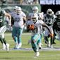 FILE - In this Sunday, Sept. 16, 2018, file photo, Miami Dolphins running back Frank Gore (21) carries the ball against the New York Jets during an NFL football game in East Rutherford, N.J. Running backs Frank Gore and Oakland’s Marshawn Lynch are still going strong in their 30s. The two teams meet on Sunday. (Brad Penner/AP Images for Panini, File)