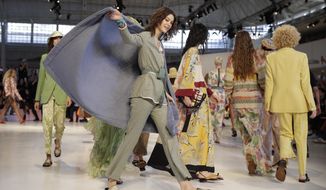 Models wear creations as part of the Etro women&#39;s 2019 Spring-Summer collection, unveiled during the Fashion Week in Milan, Italy, Friday, Sept. 21, 2018. (AP Photo/Luca Bruno)