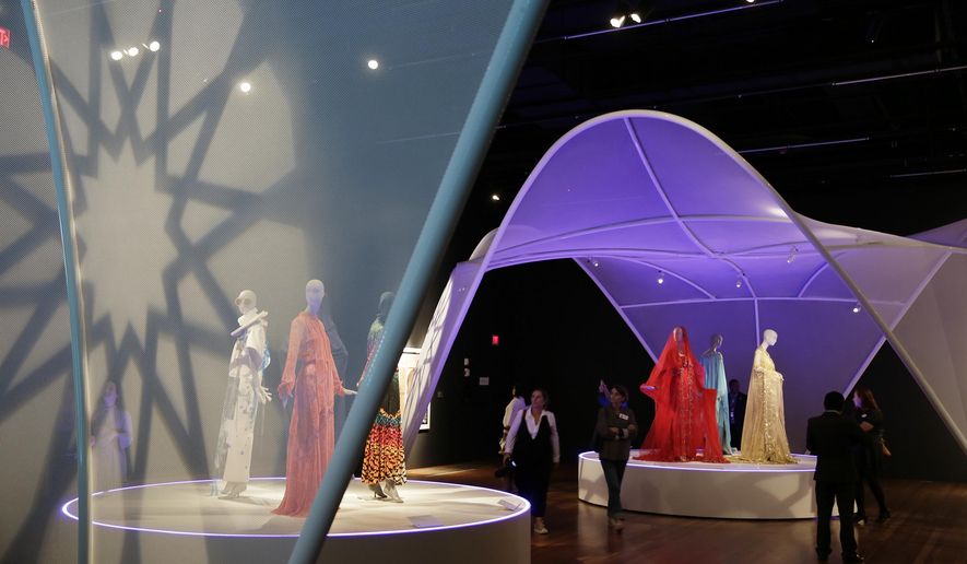 In this photo taken Thursday, Sept. 20, 2018, is the exhibit Contemporary Muslim Fashions at the M. H. de Young Memorial Museum in San Francisco. The first major museum exhibition of contemporary Muslim women&#x27;s fashion reflects designs from around the world that are vibrant and elegant, playful and diverse.   The exhibit opens on Saturday. (AP Photo/Eric Risberg)