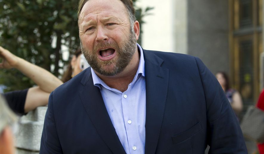 In this Sept. 5, 2018, file photo conspiracy theorist Alex Jones speaks outside of the Dirksen building of Capitol Hill after listening to Facebook COO Sheryl Sandberg and Twitter CEO Jack Dorsey testify before the Senate Intelligence Committee on &#x27;Foreign Influence Operations and Their Use of Social Media Platforms&#x27; on Capitol Hill in Washington. (AP Photo/Jose Luis Magana, File)