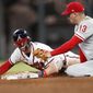 Atlanta Braves&#39; Dansby Swanson beats the tag from Philadelphia Phillies second baseman Asdrubal Cabrera (13) as he steals second base during the eighth inning of a baseball game Thursday, Sept. 20, 2018, in Atlanta. The Braves won 8-3. (AP Photo/John Bazemore)