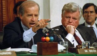 In this Oct. 12, 1991, photo, then-Senate Judiciary Committee Chairman Joe Biden, Delaware Democrat, points angrily at Clarence Thomas during comments at the end of hearings on Justice Thomas&#39; nomination to the U.S. Supreme Court on Capitol Hill. Sen. Edward Kennedy, Massachusetts Democrat, is seated next to Mr. Biden. (AP Photo/Greg Gibson, File)