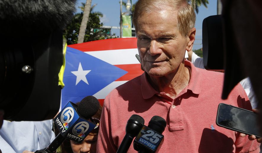 U.S. Sen. Bill Nelson, D-Fla., speaks to reporters at a rally in West Palm Beach, Fla., on Saturday, Sept. 22, 2018, marking the one-year anniversary of Hurricane Maria&#39;s devastation of Puerto Rico. (AP Photo/Ellis Rua)