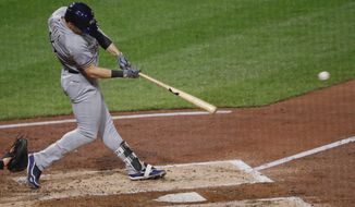 Milwaukee Brewers&#39; Ryan Braun drives in Christian Yelich with a hit in the fourth inning of a baseball game against the Pittsburgh Pirates, Friday, Sept. 21, 2018, in Pittsburgh. (AP Photo/Keith Srakocic)