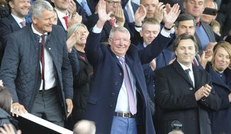 Former Manchester United manager Alex Ferguson waves as he takes his seat on the stands before the English Premier League soccer match between Manchester United and Wolverhampton Wanderers at Old Trafford stadium in Manchester, England, Saturday, Sept. 22, 2018. (AP Photo/Rui Vieira)