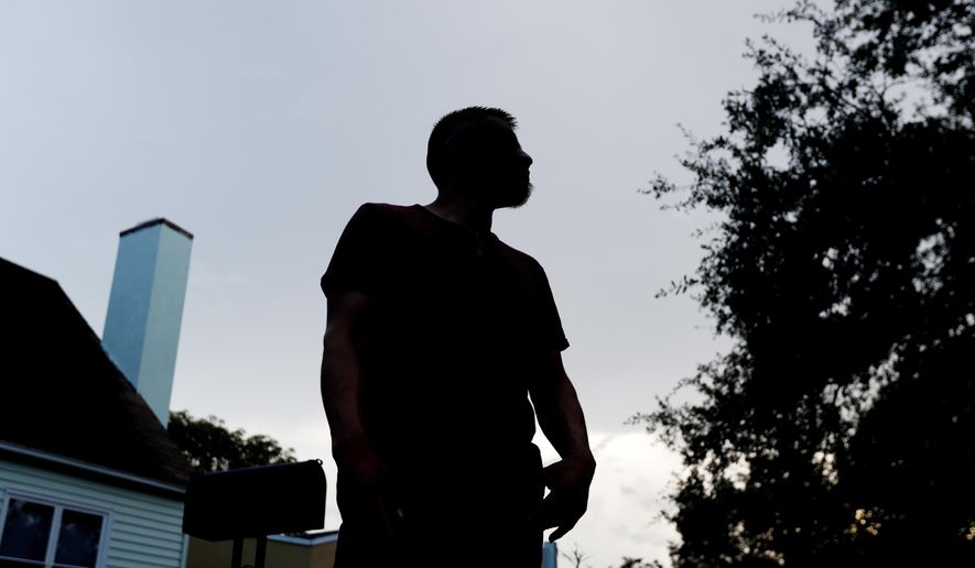 In this Friday, Sept. 14, 2018 photo, Adan, a 27-year-old Guatemalan living in south Florida, who did not wish to be further identified, poses for a photo near his home. Immigrant families hoping to reunite with children and teenagers who crossed the border alone are facing an intimidating system that includes submitting fingerprints by all adults in the household where a migrant child will live. Adan followed the process to gain custody of his 17-year-old sister in detention. Now, he wants to leave his apartment. "I feel I need to move to have a sense of security," said the landscaper about ICE knowing where he lives. (AP Photo/Wilfredo Lee)