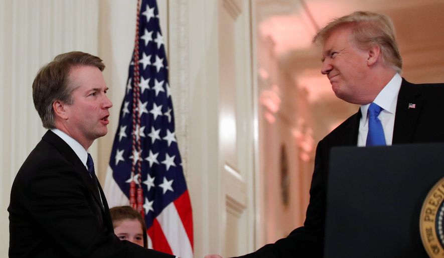 President Trump shakes hands with Judge Brett M. Kavanaugh his Supreme Court nominee, at the White House on July 9, 2018. (Associated Press) ** FILE **