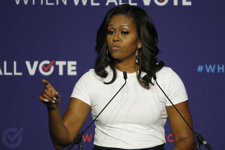 Former first lady Michelle Obama speaks at a rally to encourage voter registration Sunday, Sept. 23, 2018, in Las Vegas. (AP Photo/John Locher)