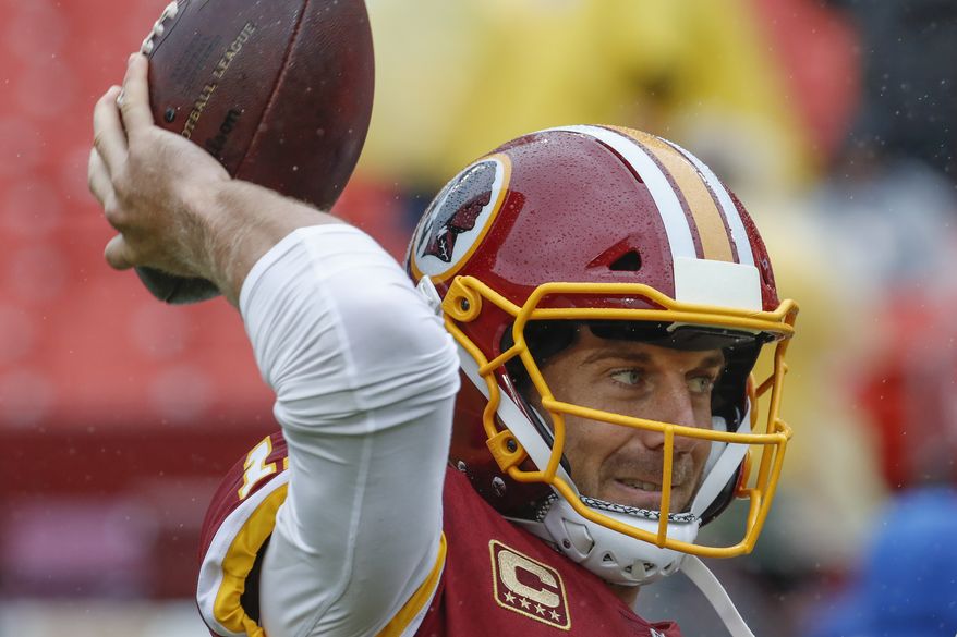 Washington Redskins quarterback Alex Smith (11) warms up before the NFL football game against the Green Bay Packers, Sunday, Sept. 23, 2018 in Landover, MD. (AP Photo/Alex Brandon)