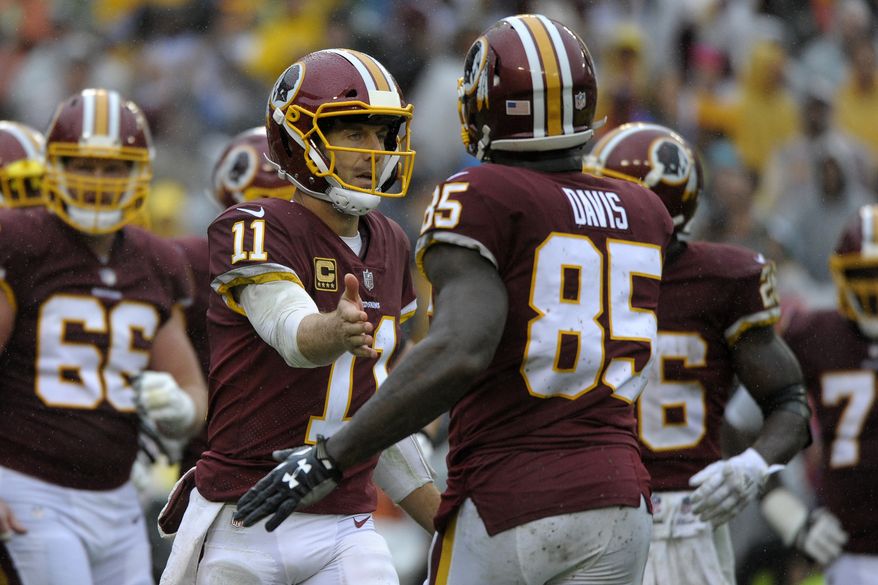 Washington Redskins quarterback Alex Smith (left) and tight end Vernon Davis (right) celebrate a touchdown during an NFL football game against the Green Bay Packers, Sunday, Sept. 23, 2018, in Landover, Md. (AP Photo/Mark Tenally)
