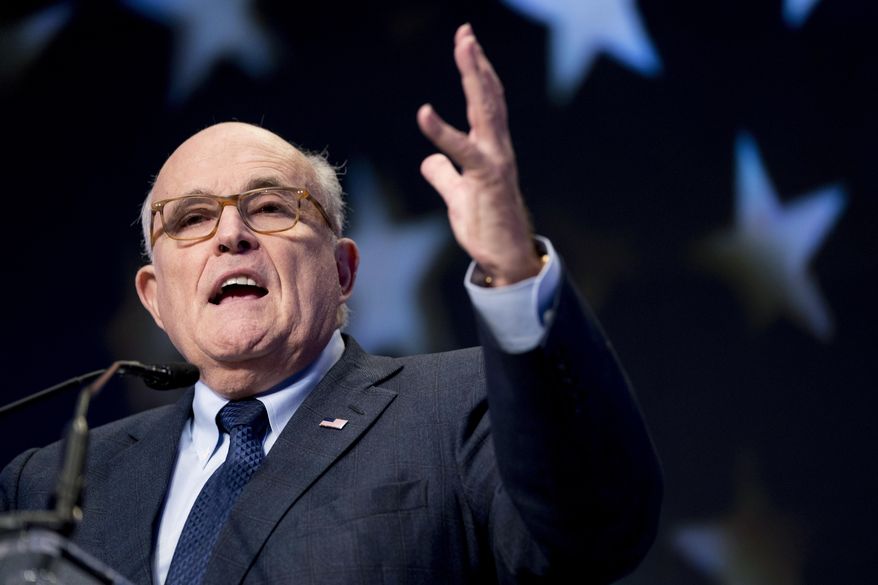 FILE - In this May 5, 2018, file photo, Rudy Giuliani, an attorney for President Donald Trump, speaks at the Iran Freedom Convention for Human Rights and democracy in Washington. On Saturday, Sept. 22, 2018, Arab separatists killed at least 25 people in an attack targeting a military parade in Iran, and Giuliani declared that the Iranian government would be toppled. From Saturday’s attack in Ahvaz to America resuming sanctions despite Iran’s compliance with the 2015 nuclear deal, pressure on Tehran is rising and its leaders are growing more combative toward the West. (AP Photo/Andrew Harnik, File)