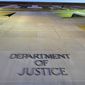 In this May 14, 2013, file photo, the Department of Justice headquarters building in Washington is photographed early in the morning. (AP Photo/J. David Ake, File)