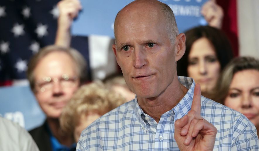 In this Sept. 6, 2018, file photo, Florida Gov. Rick Scott speaks to supporters at Republican rally in Orlando, Fla. Top Florida Republicans including Scott have been quick to say President Donald Trump is wrong about the death toll in Puerto Rico. Scott said he disagreed with the president and that he has seen the “devastation firsthand.” (AP Photo/John Raoux) **FILE**