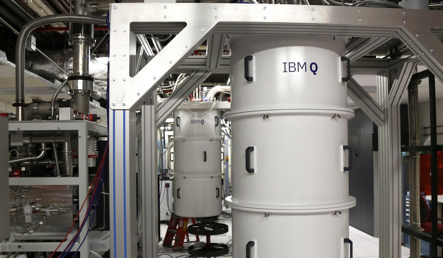 This Feb. 27, 2018, photo shows a quantum computer, encased in a refrigerator that keeps the temperature close to zero kelvin in the quantum computing lab at the IBM Thomas J. Watson Research Center in Yorktown Heights, N.Y. On Aug. 26, 2020, the Trump administration announced it is building 12 new artificial intelligence and quantum information science institutes nationwide, granting $1 billion in awards over the next five years for the project. (AP Photo/Seth Wenig) **FILE**