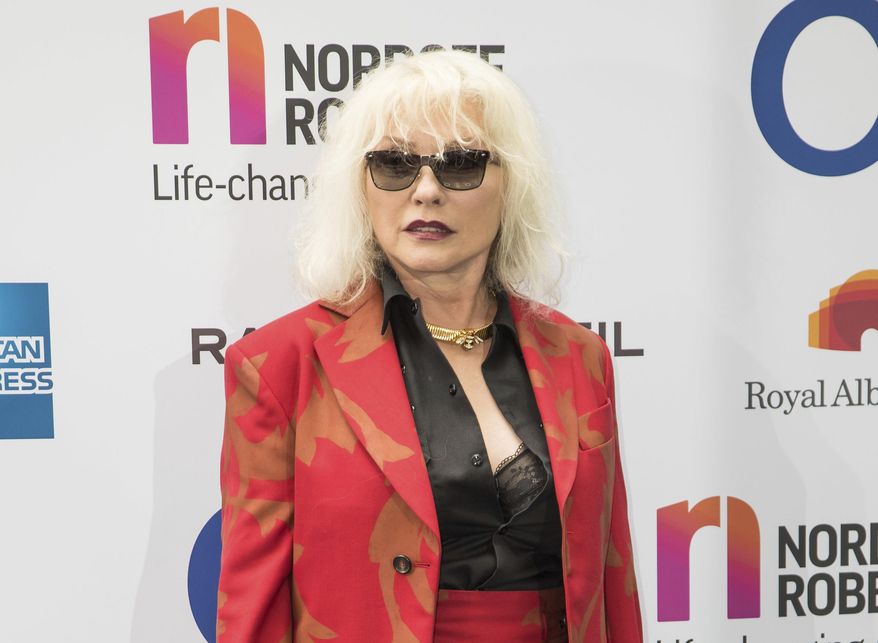 FILE - In this June 30, 2017 file photo, musician Debbie Harry of Blondie arrives at the Silver Clef Awards in London. Blondie will be playing two nights in Cuba next March as part of a four-day cultural exchange program. The iconic rock group announced Monday that they will play two concerts during their March 14-18 visit in Havana, which will also feature Cuban musicians Alain Perez, David Torrens and Sintesis. (Photo by Vianney Le Caer/Invision/AP, File)