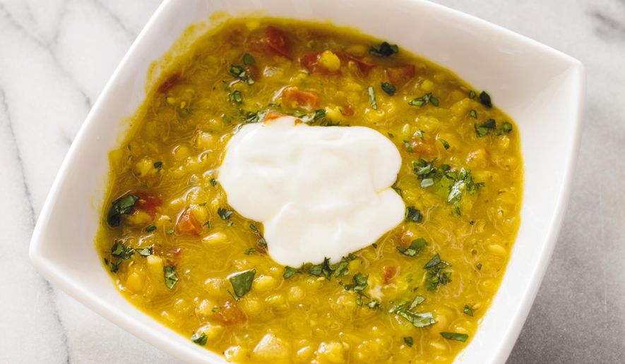 This undated photo provided by America's Test Kitchen in September 2018 shows curried red lentil soup in Brookline, Mass. This recipe appears in the cookbook “All-Time Best Soups.” (Daniel J. van Ackere/America's Test Kitchen via AP)
