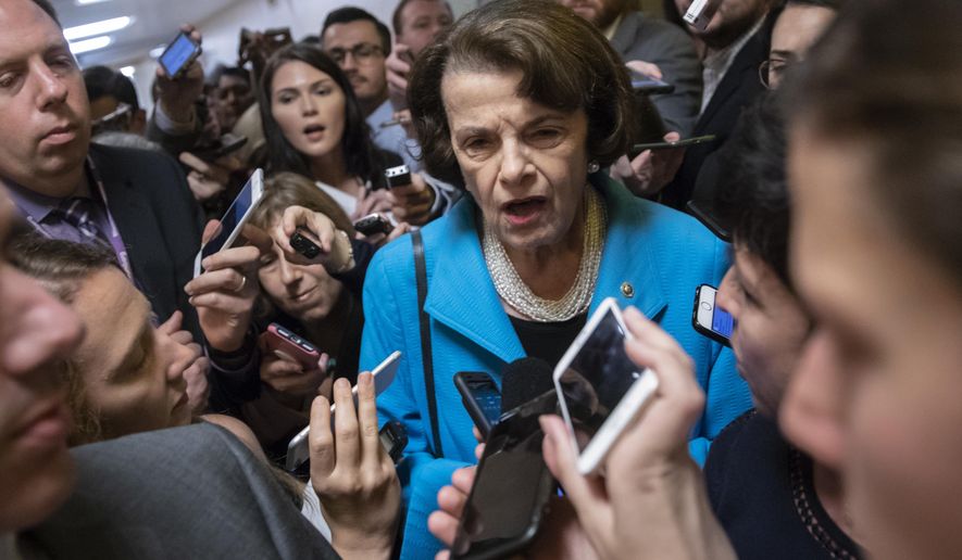 FILE - In this Tuesday, Sept. 18, 2018, file photo, Sen. Dianne Feinstein, D-Calif., the ranking member on the Senate Judiciary Committee, responds to reporters&#x27; questions on Supreme Court nominee Brett Kavanaugh amid scrutiny of a woman&#x27;s claim he sexually assaulted her at a party when they were in high school, on Capitol Hill in Washington. (AP Photo/J. Scott Applewhite, File)