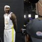 Golden State Warriors&#39; DeMarcus Cousins, left, smiles while posing for photos for a news photographer during media day at the NBA basketball team&#39;s practice facility in Oakland, Calif., Monday, Sept. 24, 2018. (AP Photo/Jeff Chiu)