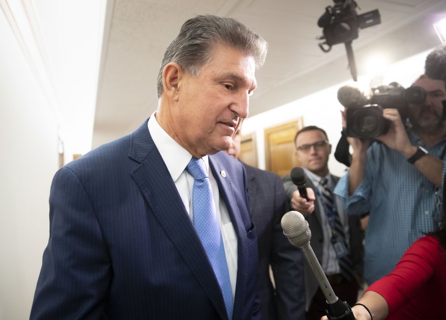 Sen. Joe Manchin, D-W.Va., talks to reporters about President Donald Trump's embattled Supreme Court nominee, Brett Kavanaugh, on Capitol Hill in Washington, Tuesday, Sept. 25, 2018. (AP Photo/J. Scott Applewhite) **FILE**