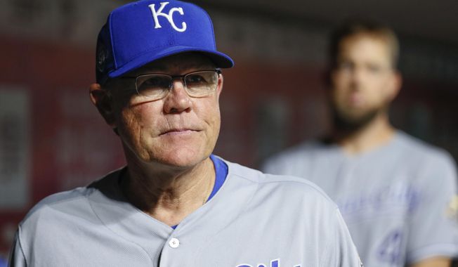Kansas City Royals manager Ned Yost stands in the dugout during the fourth inning of the team&#x27;s baseball game against the Cincinnati Reds, Tuesday, Sept. 25, 2018, in Cincinnati. (AP Photo/John Minchillo)