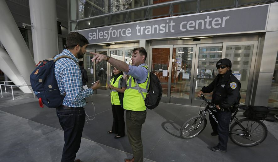 Mike Eshleman, with AC Transit, directs people away from the Salesforce Transit Center following its closure, Tuesday, Sept. 25, 2018, in San Francisco. San Francisco officials shut down the city&#x27;s celebrated new $2.2 billion transit terminal Tuesday after discovering a crack in a support beam under the center&#x27;s public roof garden. Coined the &amp;quot;Grand Central of the West,&amp;quot; the Salesforce Transit Center opened in August near the heart of downtown after nearly a decade of construction. It was expected to accommodate 100,000 passengers each weekday, and up to 45 million people a year. (AP Photo/Eric Risberg)