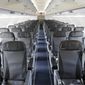 FILE - This Thursday, March 16, 2017, file photo shows the interior of a commercial airliner at John F. Kennedy International Airport in New York. On Wednesday, Sept. 26, 2018, the House voted to direct the federal government to set a minimum size for airline seats, bar passengers from being kicked off overbooked planes, and consider whether to restrict animals on planes. (AP Photo/Seth Wenig, File)