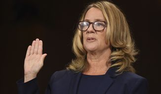 Christine Blasey Ford is sworn in to testify before the Senate Judiciary Committee on Capitol Hill in Washington, Thursday, Sept. 27, 2018. (Saul Loeb/Pool Photo via AP)