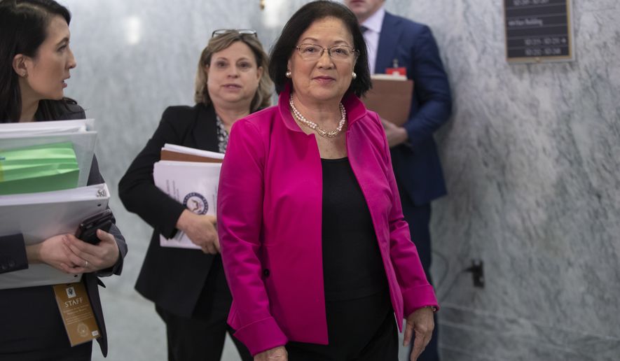Sen. Mazie Hirono, D-Hawaii, walks with her staff back to the Senate Judiciary Committee room during a break from testimony by Christine Blasey Ford on Capitol Hill in Washington, Thursday, Sept. 27, 2018. (AP Photo/J. Scott Applewhite)