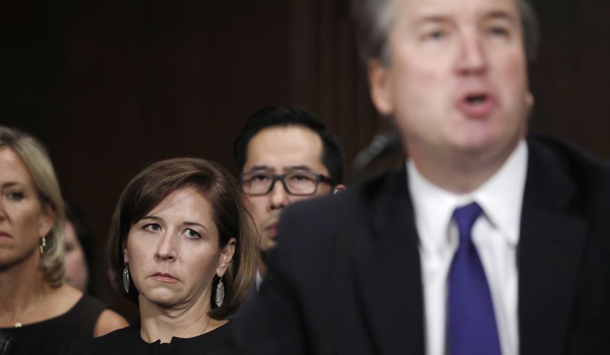 Supreme Court nominee Brett Kavanaugh testifies before the Senate Judiciary Committee on Capitol Hill in Washington, Thursday, Sept. 27, 2018, as his wife Ashley Estes Kavanaugh watches. (Jim Bourg/Pool Photo via AP)