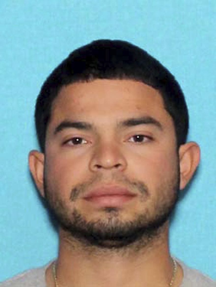 This undated photo provided by Las Vegas police shows Jonathan Mora. Police say Mora is sought on criminal charges after running from the scene of a high-speed vehicle crash on Sept. 15, 2018, leaving a 10-year-old boy and a 20-year-old passenger in his burning car. ( Las Vegas Police Department via AP)
