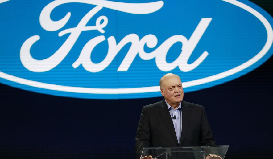 FILE- In this Jan. 14, 2018, file photo Ford President and CEO Jim Hackett prepares to address the media at the North American International Auto Show in Detroit. Hackett said Wednesday, Sept. 16, during a television interview that the Trump administration's tariffs on imported steel and aluminum will cost the company $1 billion. (AP Photo/Carlos Osorio, File)