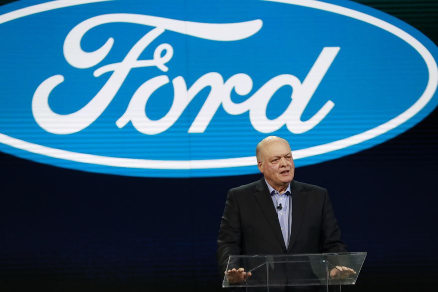 FILE- In this Jan. 14, 2018, file photo Ford President and CEO Jim Hackett prepares to address the media at the North American International Auto Show in Detroit. Hackett said Wednesday, Sept. 16, during a television interview that the Trump administration's tariffs on imported steel and aluminum will cost the company $1 billion. (AP Photo/Carlos Osorio, File)