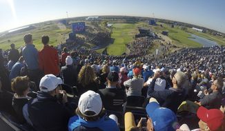 A view from the back of the grandstand overlooking the 1st tee on the third day of practice for the Ryder Cup at Le Golf National in Saint-Quentin-en-Yvelines, outside Paris, France, Thursday, Sept. 27, 2018. The grandstand seats nearly 7,000 people, the largest at any golf tournament. (AP Photo/John Leicester)