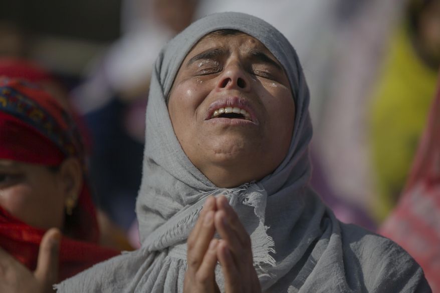 A Kashmiri woman grieves during the funeral of Mohammad Saleem Malik, a civilian, in Srinagar, Indian controlled Kashmir, Thursday, Sep. 27, 2018. Residents say Malik was killed by Indian troops during an anti militancy operation in Srinagar. (AP Photo/Dar Yasin)