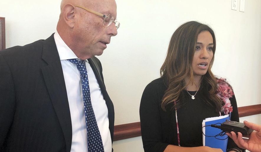 State. Rep. Monica Youngblood, R-Albuquerque, with her attorney Paul Kennedy, speaks to reporters on Tuesday, Sept. 25, 2018, after her trial in a DWI case at a courthouse in Albuquerque, N.M. A judge on Tuesday found Youngblood guilty of aggravated drunken driving, citing her performance and seemingly flippant demeanor during a field sobriety test last spring. (AP Photo/Mary Hudetz)